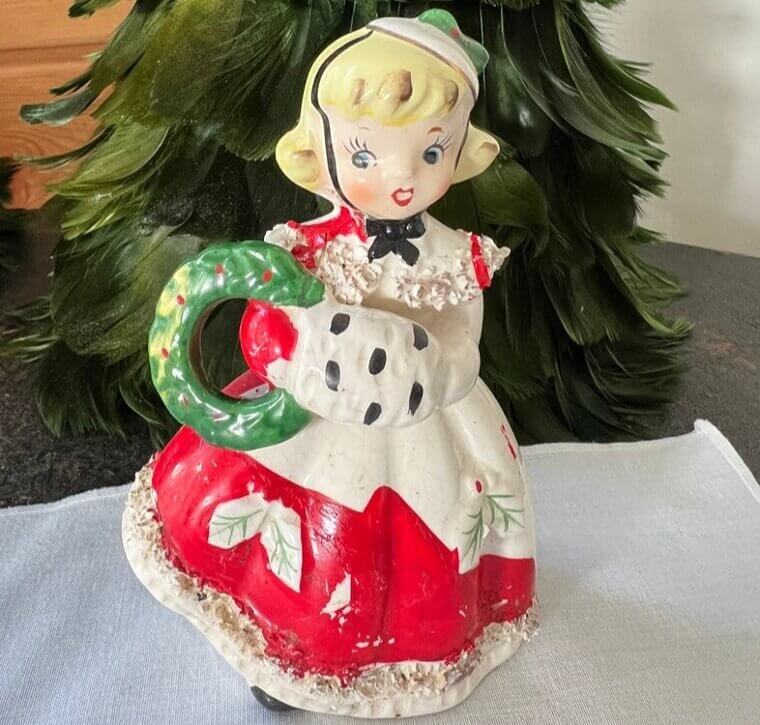 Christmas Shopper Figurine Holding A Wreath - $135
