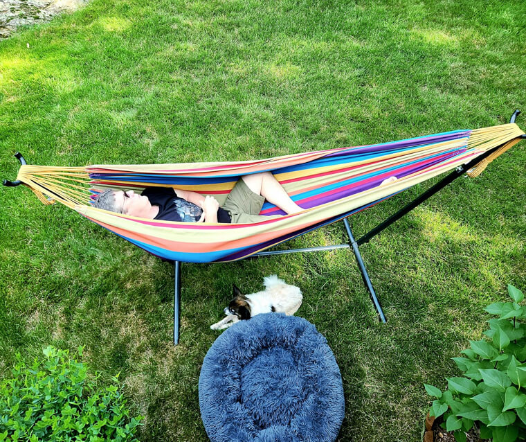 A Spacious Two-Person Cotton Hammock Complete With a Heavy-Duty Metal Frame for Those Who Don't Have the Perfect Trees to Hang a Hammock.