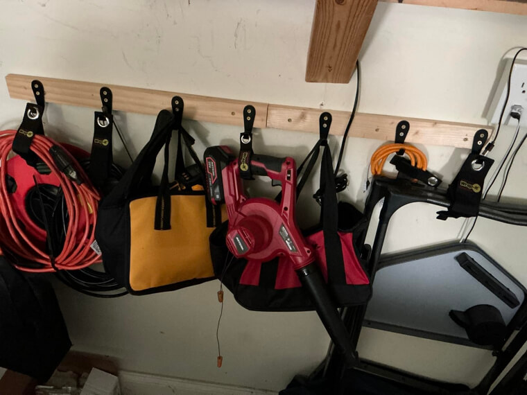 A Set of Heavy-Duty Wrap-It Storage Straps to Finally Conquer the Tangled Nightmare of Extension Cords and Garden Hoses in Your Garage.