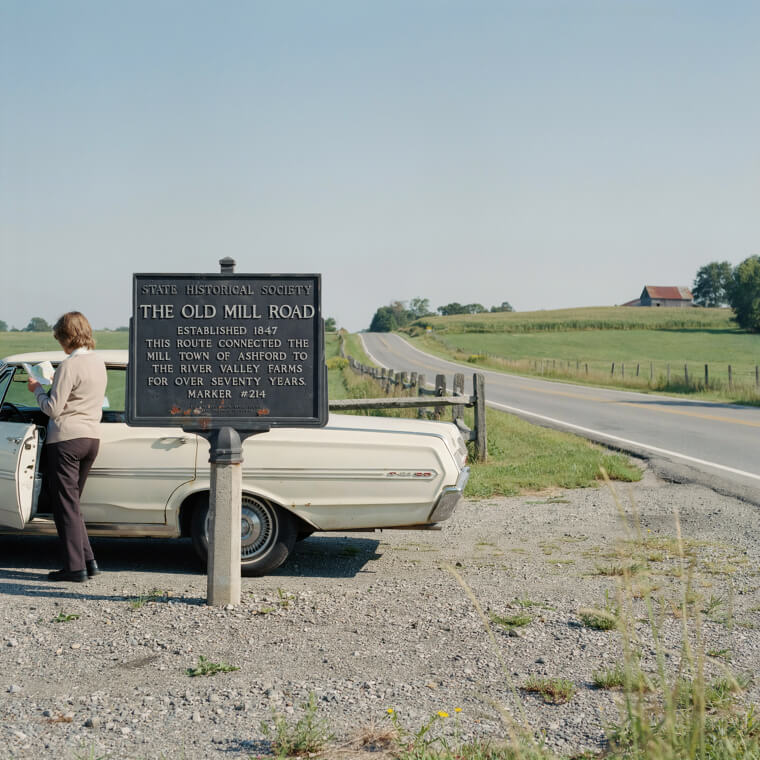 Stopping to Read Historic Cast-Iron Roadside Markers