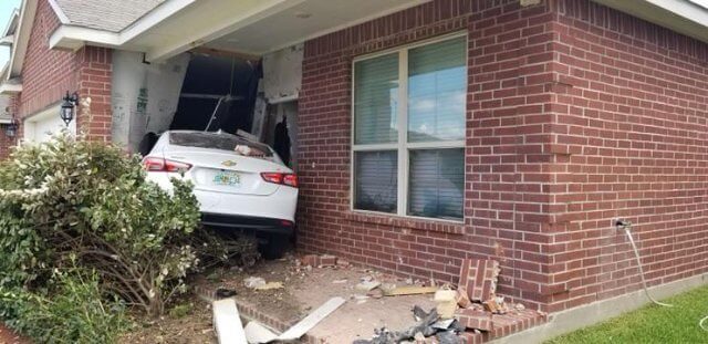 An Unusual Wake Up Call Involves A Car And A House