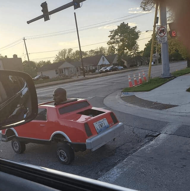 A Man in a Micro Car