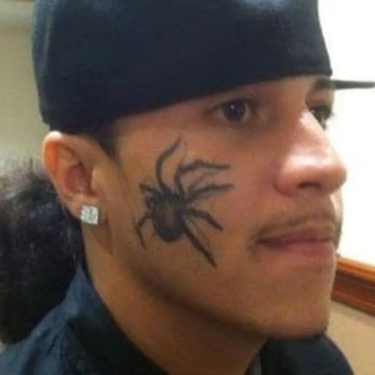 A Spider Facial Tattoo Is a Strong Decision
